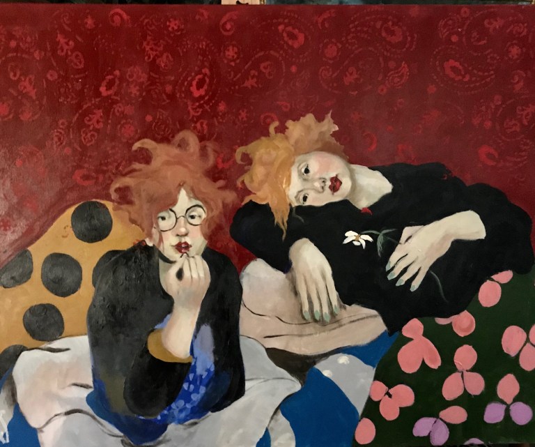 Expressionist painting of two red-haired women lounging.