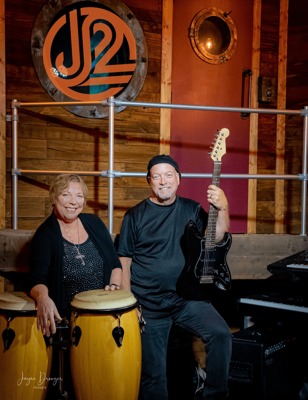 TCS-Jennifer-6 Musicians with guitar and congas in studio setting.